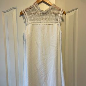 Cut in a timelessly elegant A-line silhouette, this dress with sheer lace panel